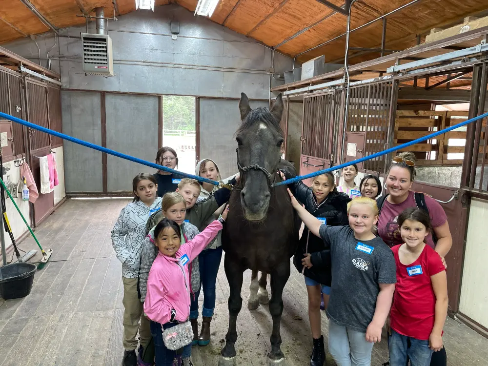 Our horse Johnie with several of our students